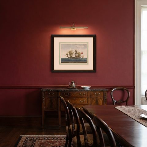 Before the Gales: An English Frigate Awaiting Wind, circa 1920, shown framed in a room