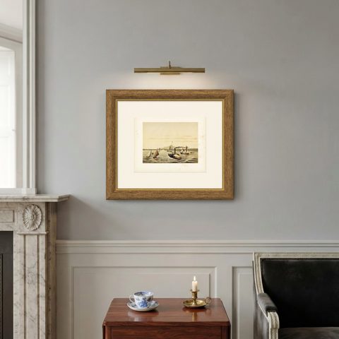 Antique Print of the Ciliwung Paddle Steamer in Tanjung Priok Harbour, Batavia, shown framed on a wall