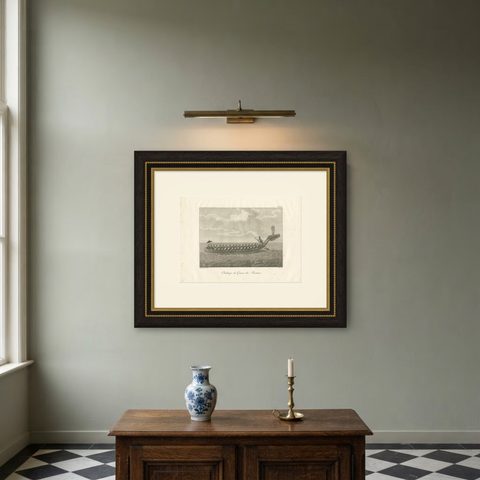 Antique Print of a Burmese War Boat by Symes '1800', shown framed on a wall