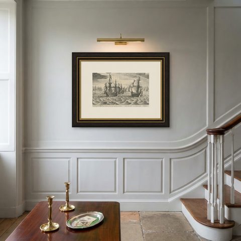 Antique Print of a Fleet of Nine Ships Departing to the East Indies '1603', shown framed on a wall