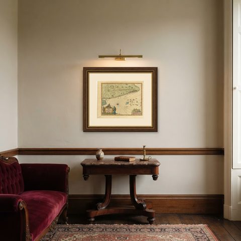 Antique Map of the Malabar Coast by Baldaeus, 1744, shown framed in a room