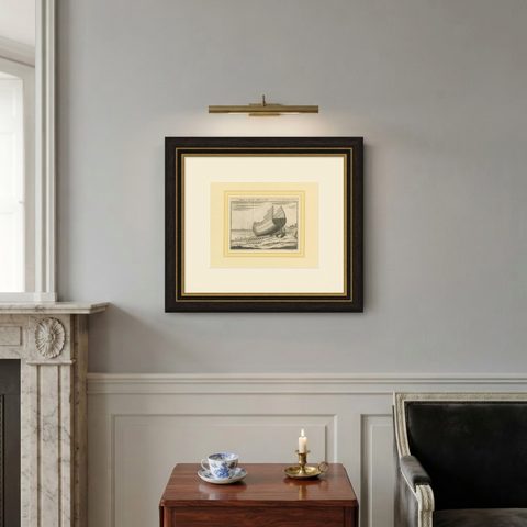 Antique Print of a Ship Launching by Pluche '1735', shown framed on a wall