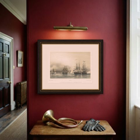 Antique Litograph of a Combat Between French and British Ships, 1844, shown framed on a wall