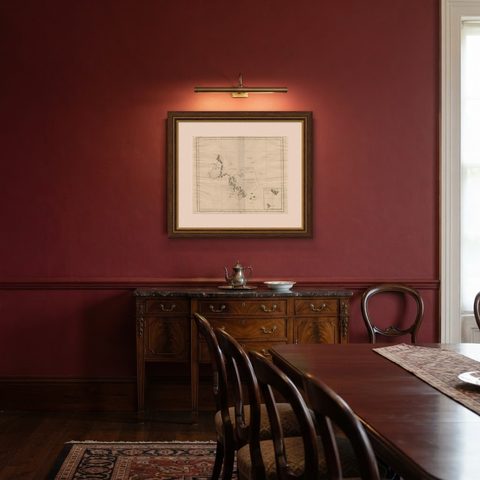 Antique Map of Kerguelens Island Coast in the Indian Ocean by Cook, 1785, shown framed in a room